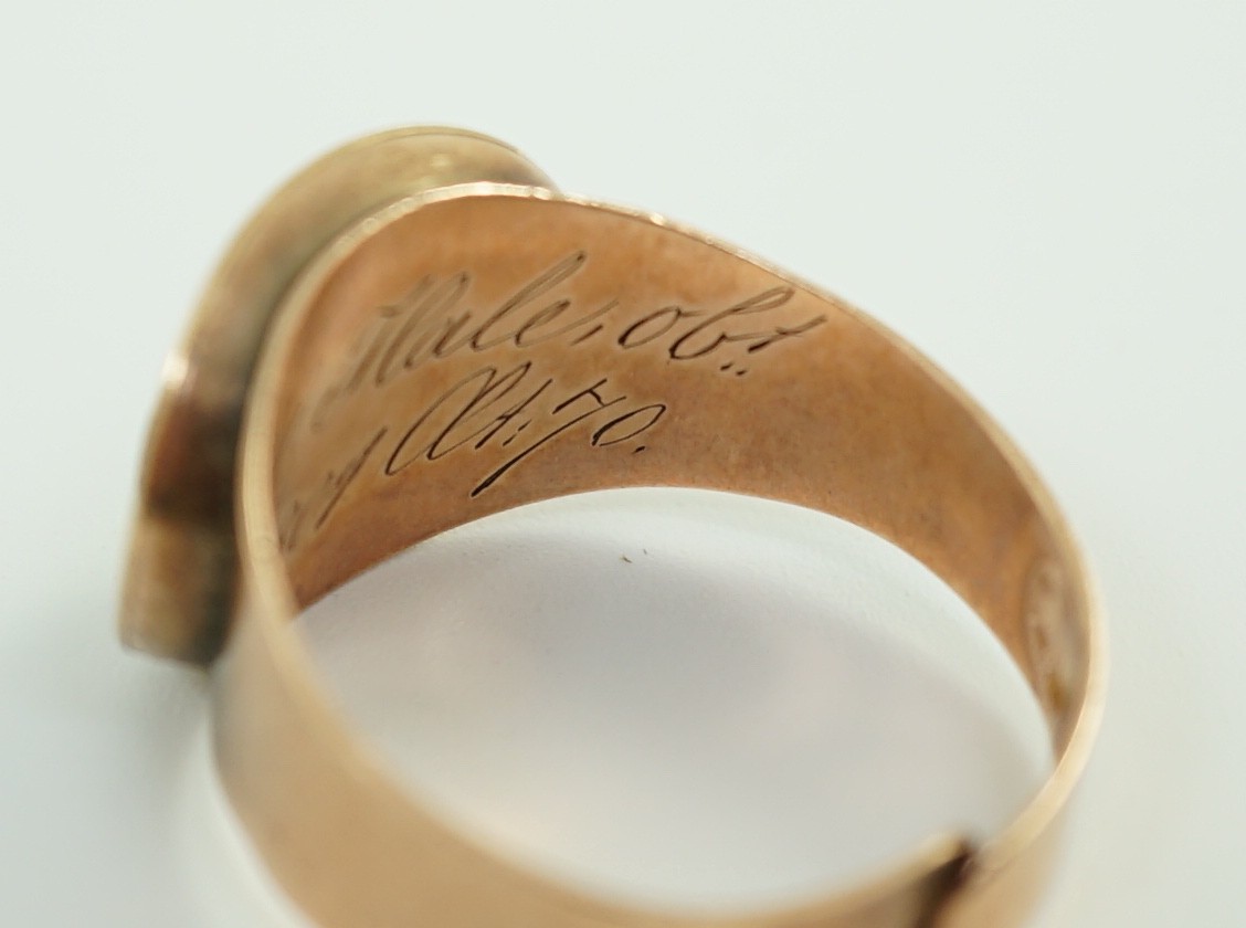 A George III gold and two colour enamel mourning ring, with adjustable 'buckle' shank